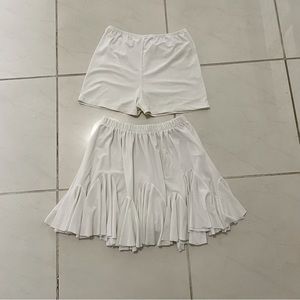 white pleated skirt.  has tights.